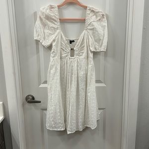 White elastic back half sleeve dress with floral print, buckled front detailing